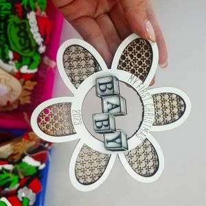 Wooden flowers attached to toy letters for children